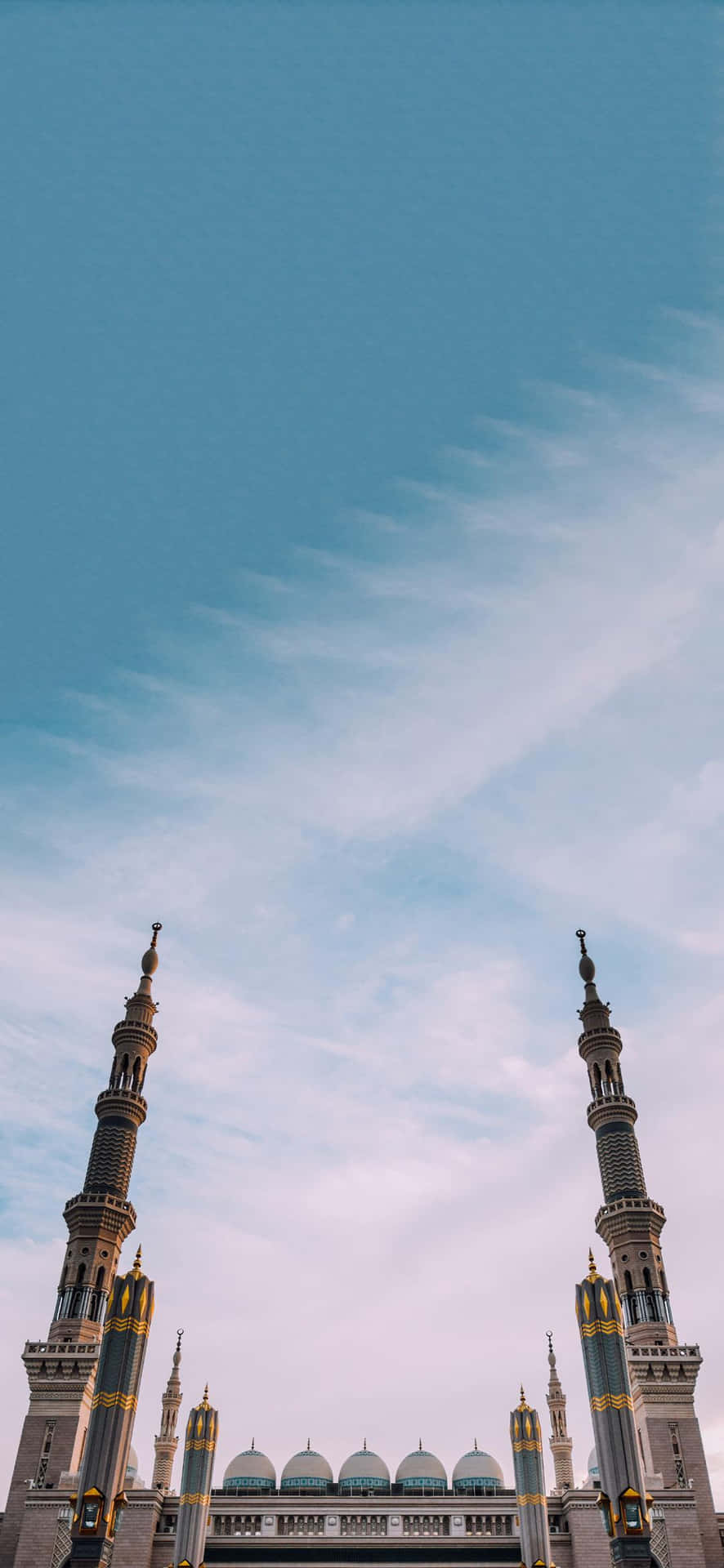 Mosque_ Minarets_ Against_ Blue_ Sky Background