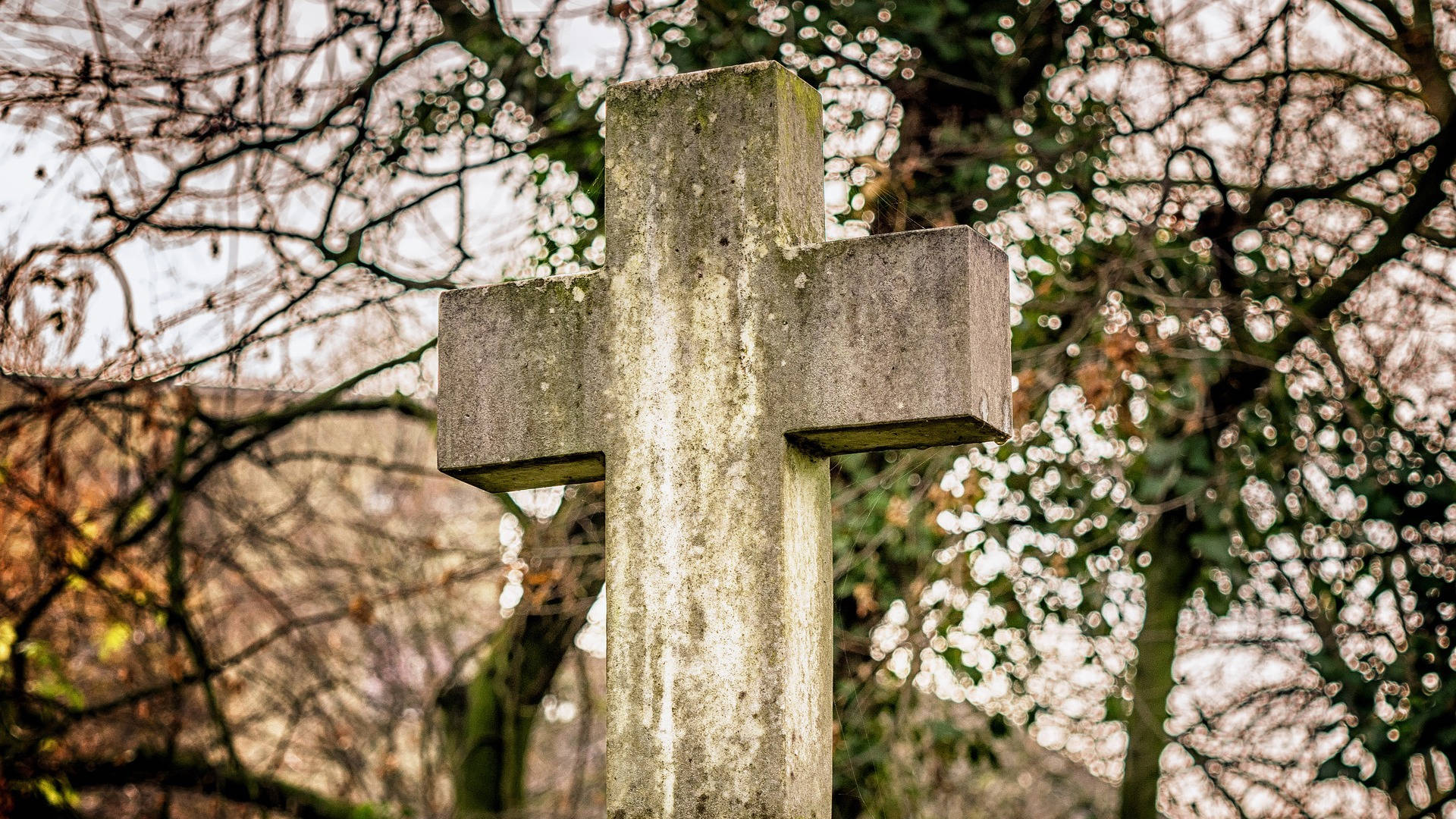 Moss-covered Cemented Cross Symbol Of The Christianity Religion