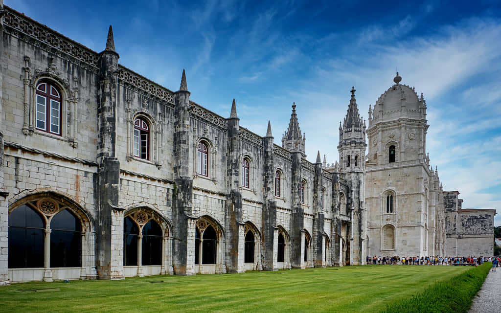 Mosteiro Dos Jeronimos Under Blue Sky Background