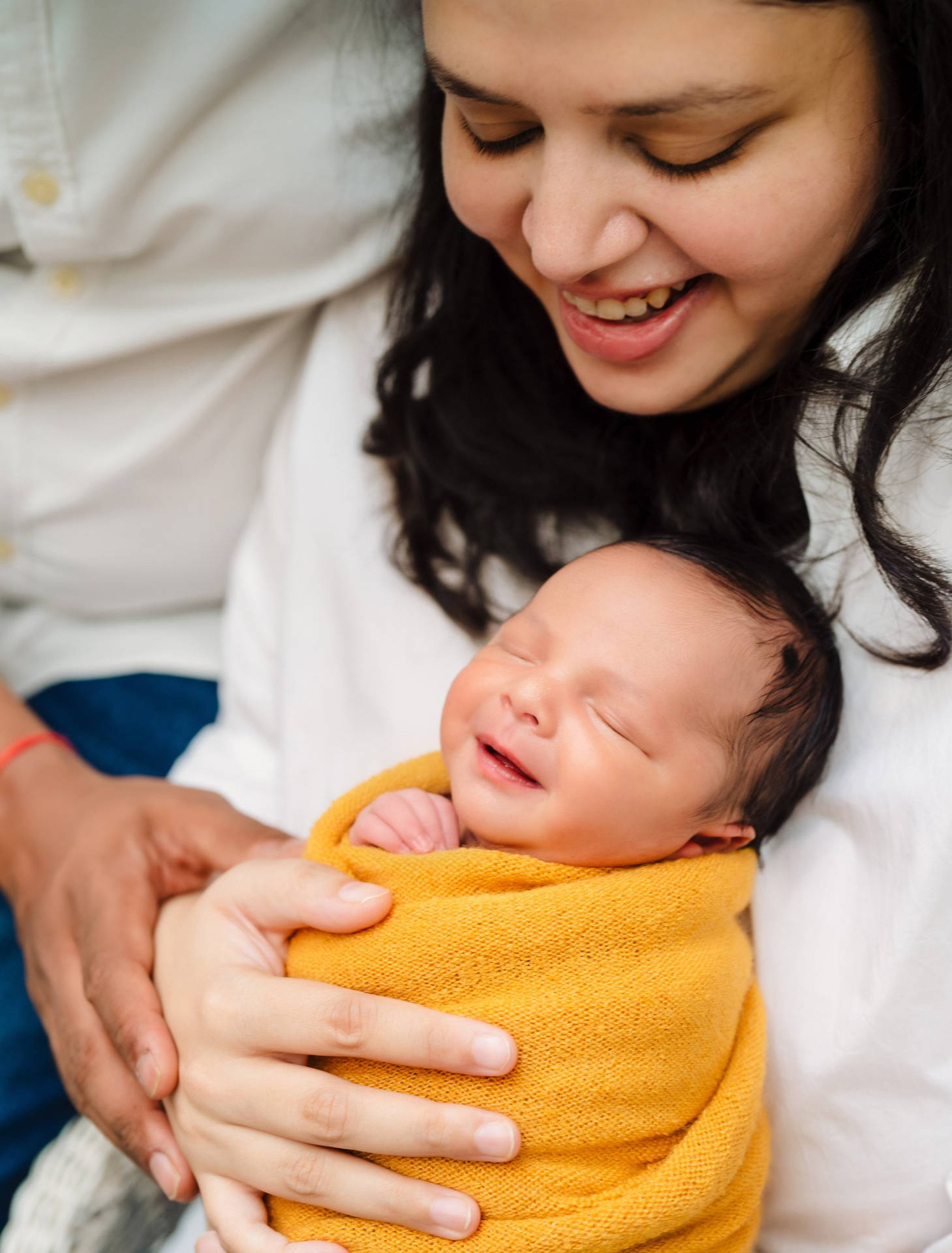 Mother And Baby In Yellow Swaddle Background