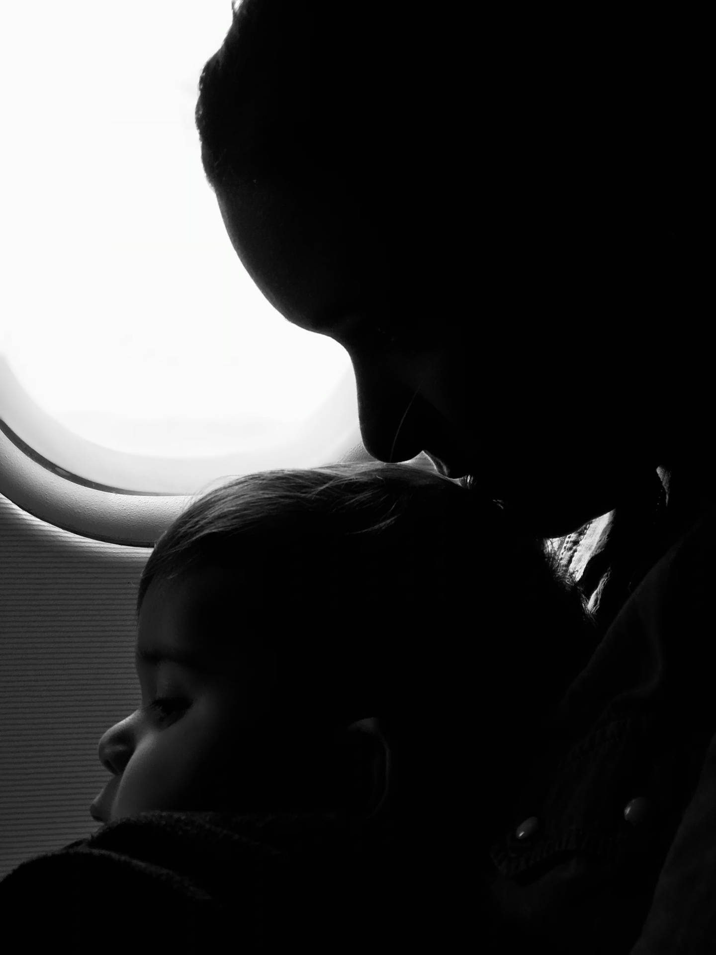 Mother And Baby On A Plane Background