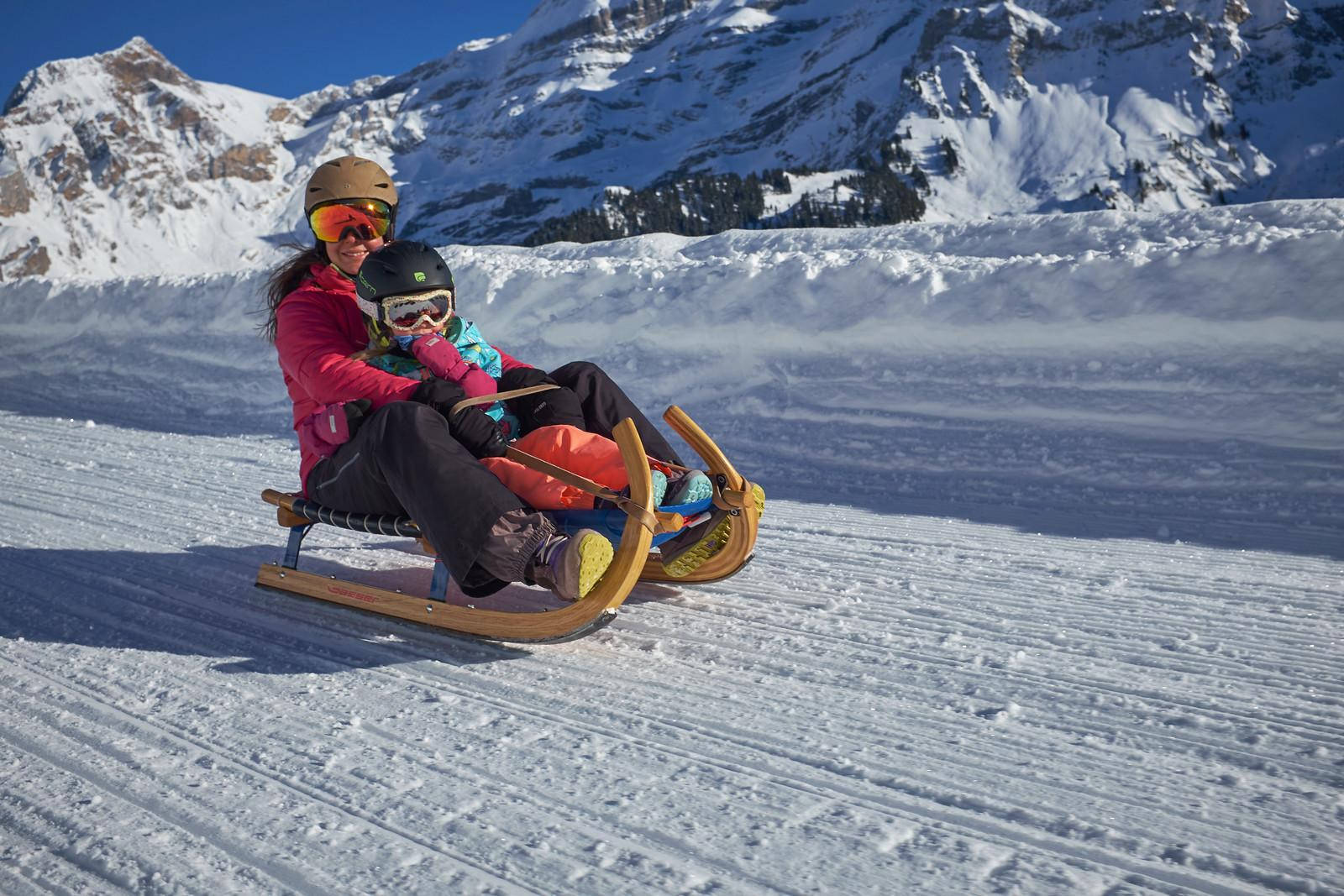 Mother And Baby Sledding