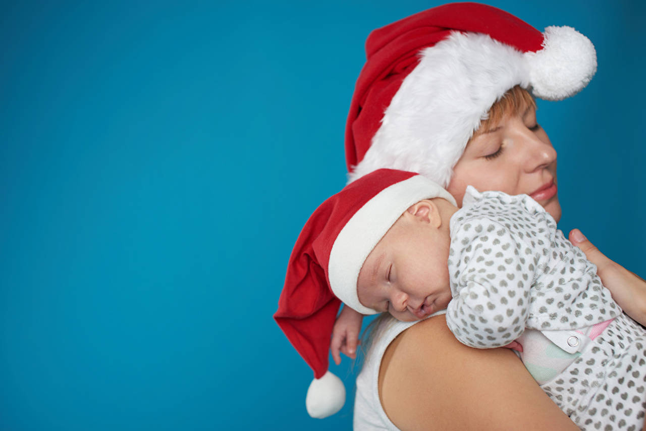 Mother And Baby Wearing Christmas Hats