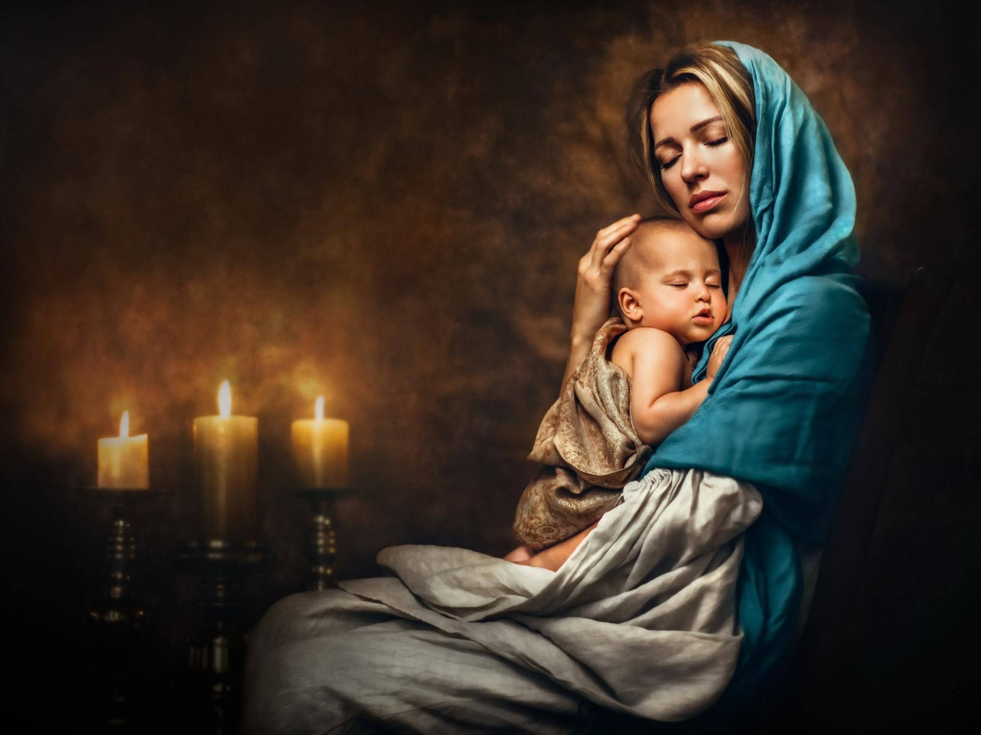 Mother And Baby With Candles Background