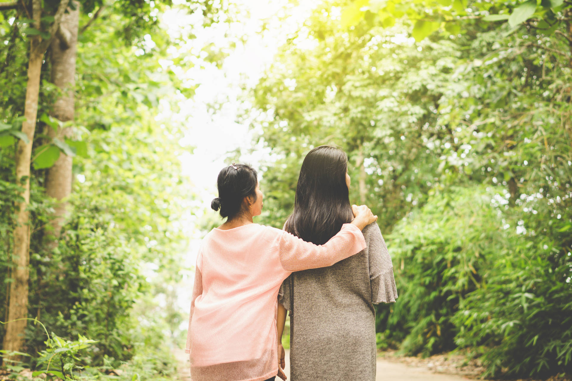 Mother And Daughter Forest Stroll Background