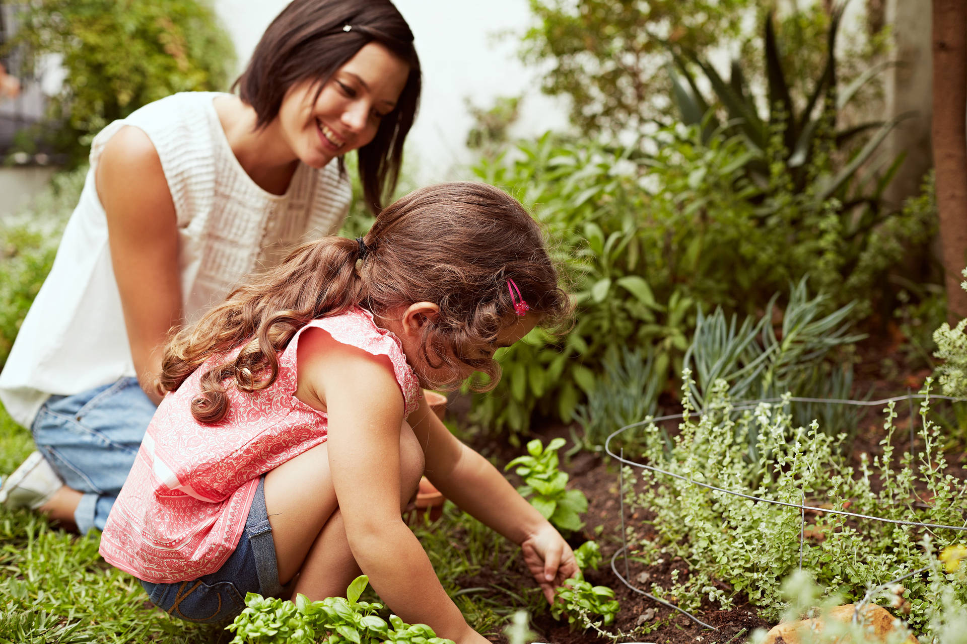 Mother And Daughter Gardening Background