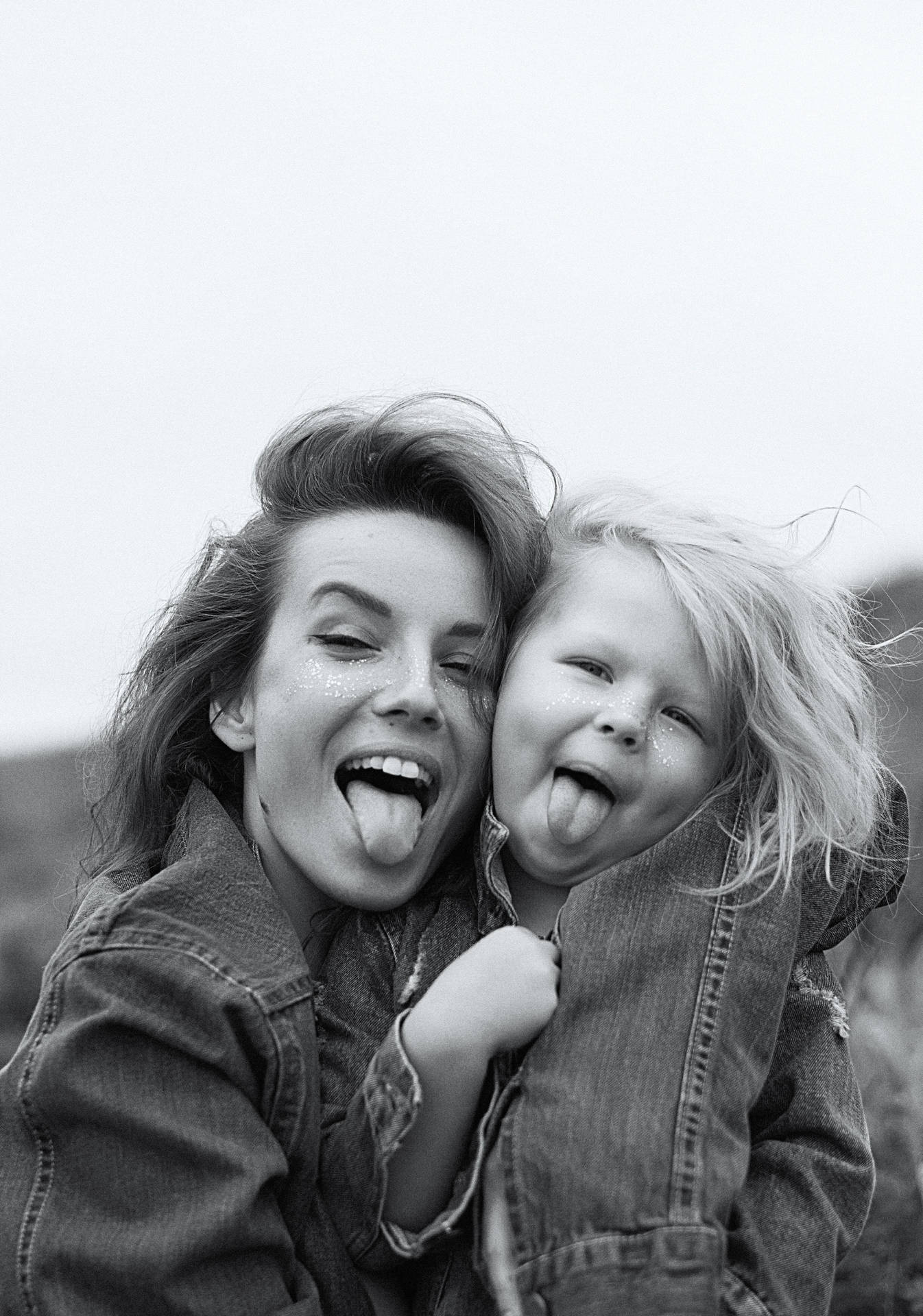 Mother And Daughter Making Silly Faces Background