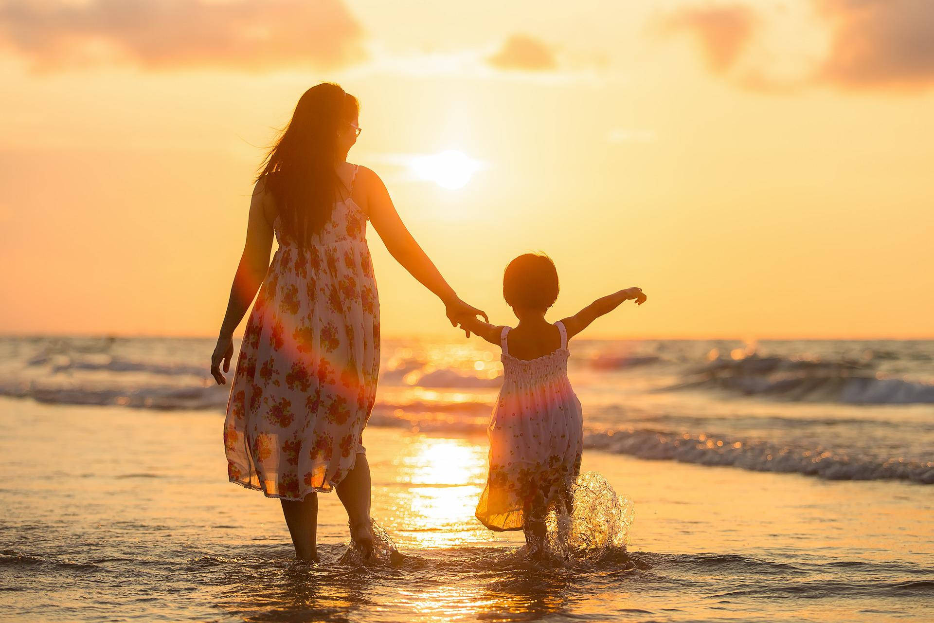 Mother And Daughter On Sunlit Shores