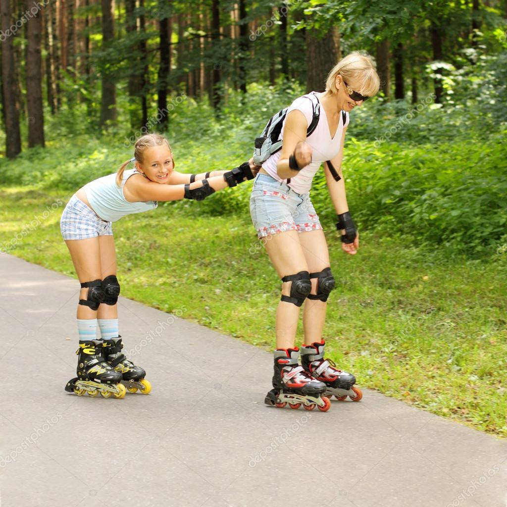 Mother And Daughter Rollerblading Bonding