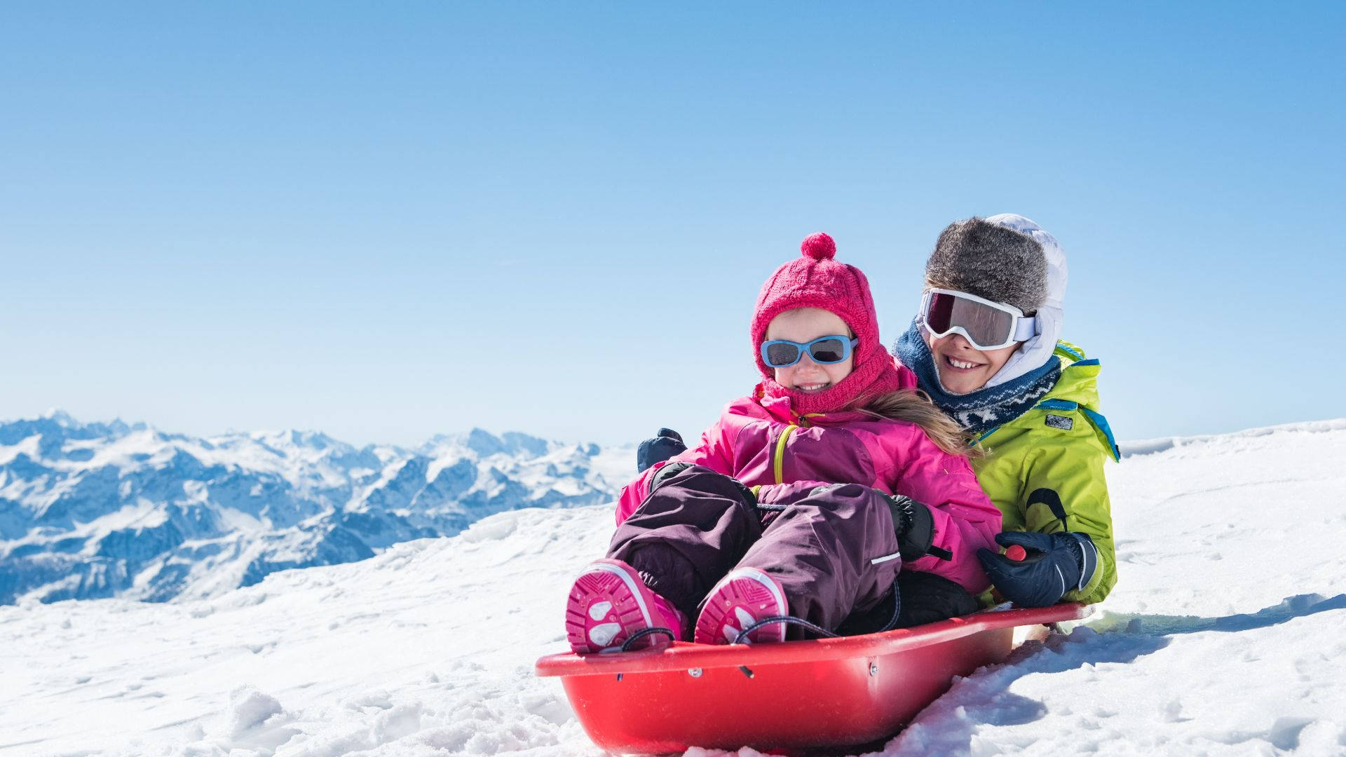 Mother And Daughter Sledding Bond Background