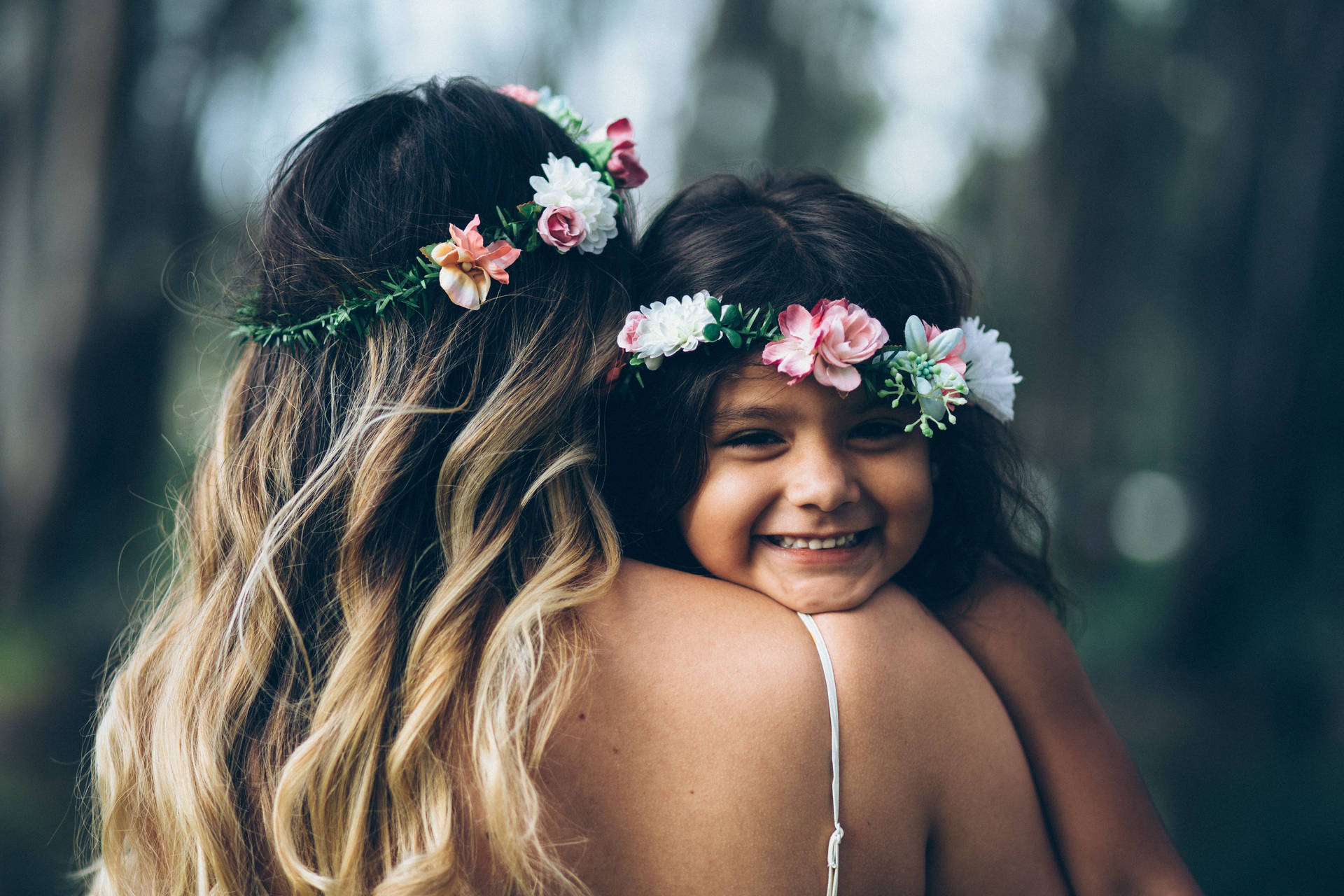 Mother And Daughter Wearing Flower Crown Background