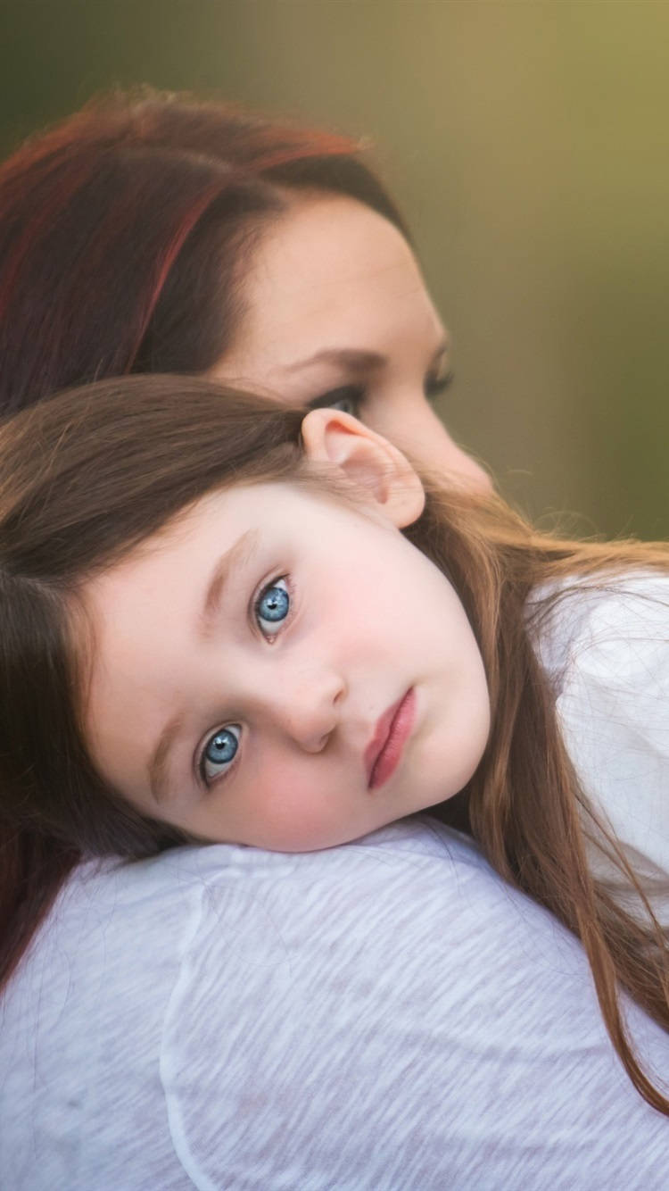 Mother And Daughter With Bright Eyes Background