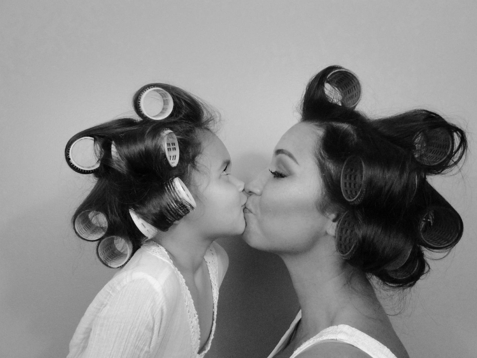 Mother And Daughter With Curlers Background