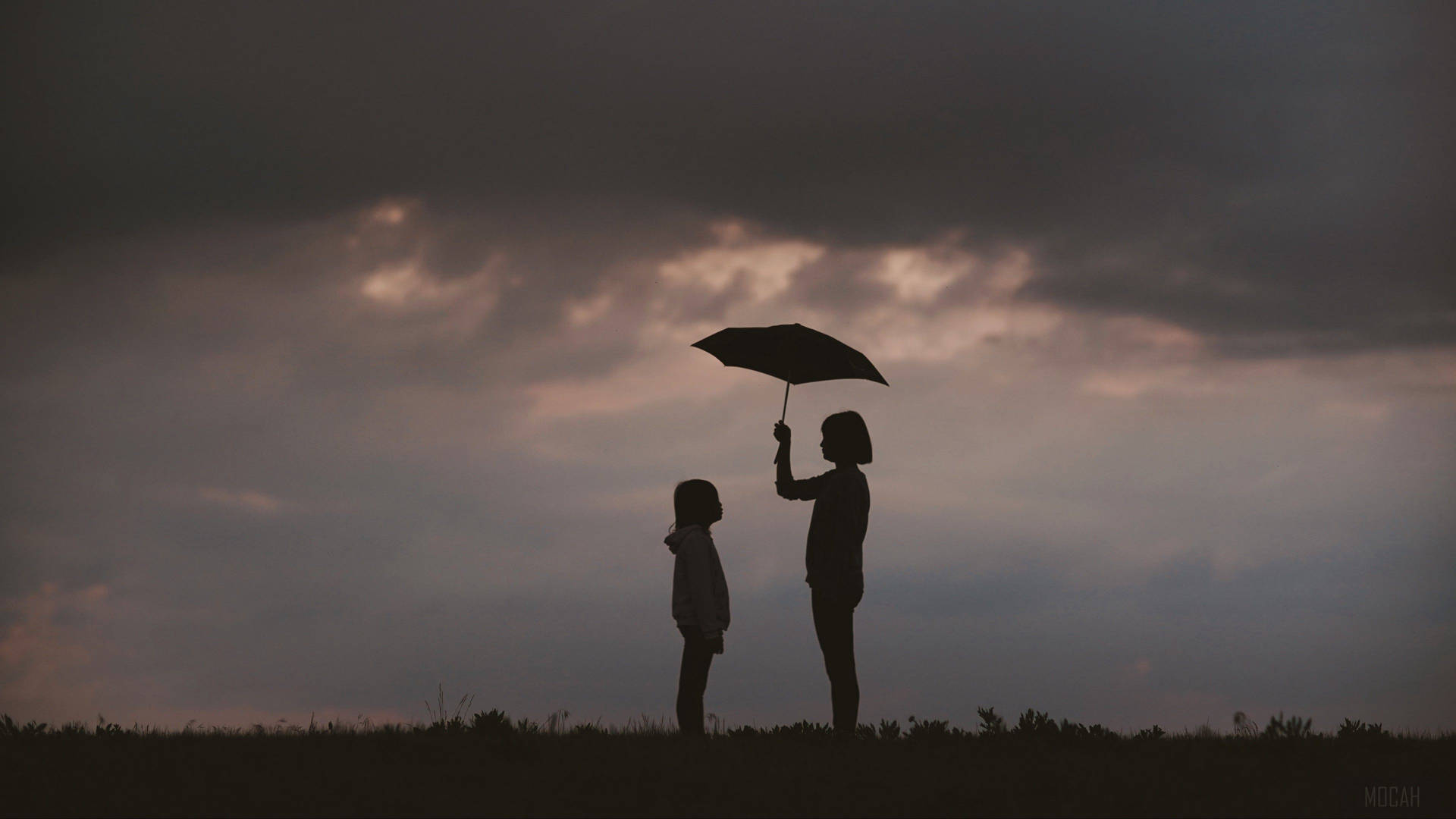 Mother And Daughter With Umbrella