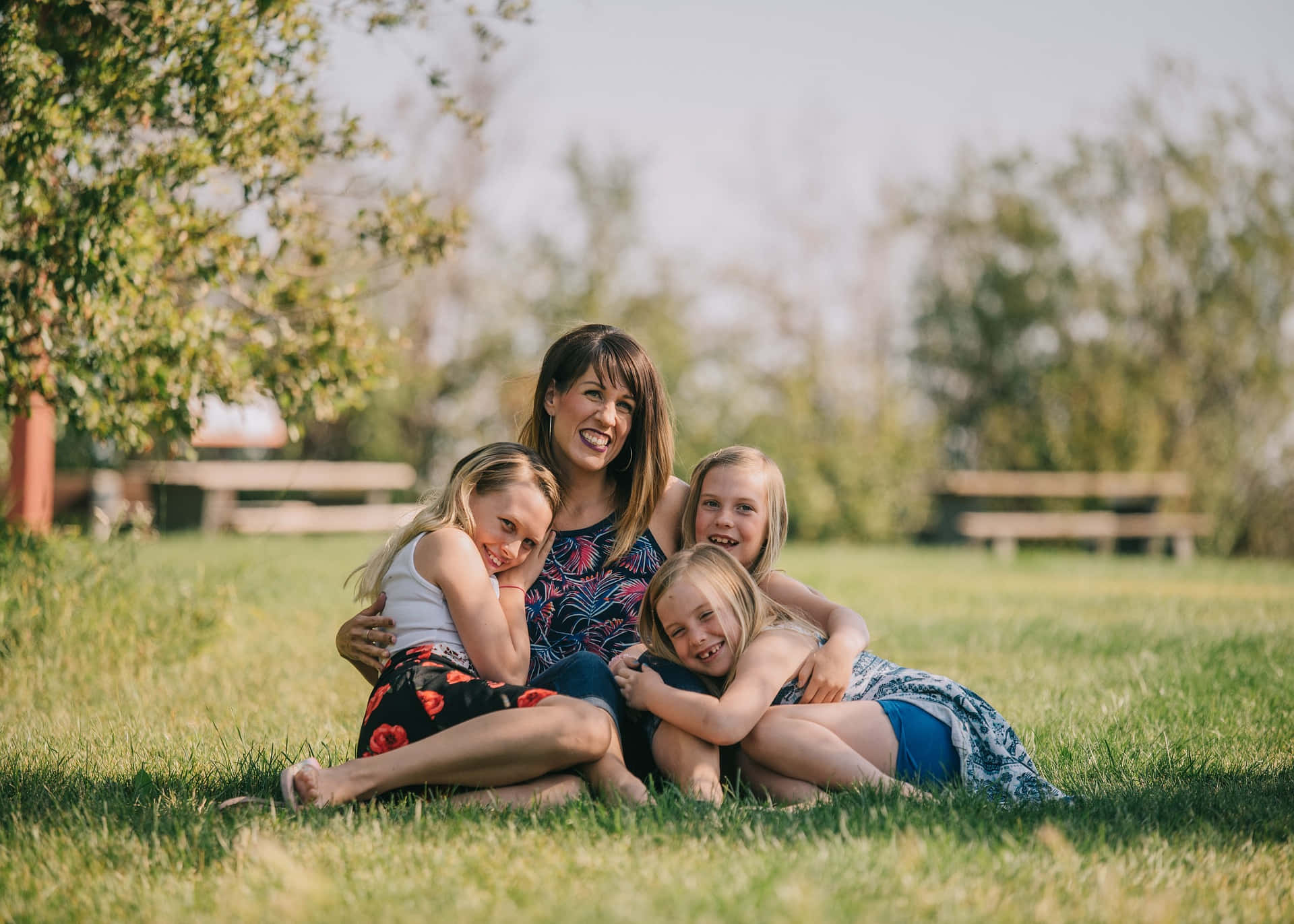 Mother And Her Three Daughters Representing A Tangible Family Love Background