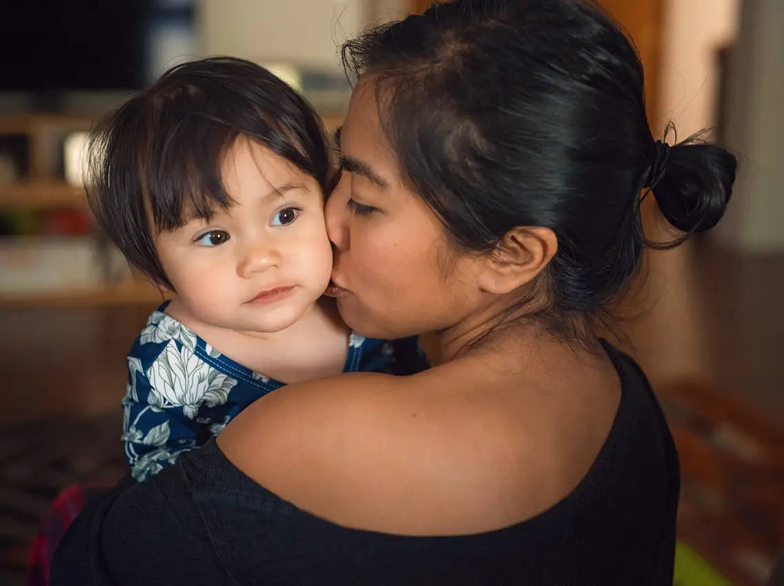 Mother And Wide Eyed Baby Background