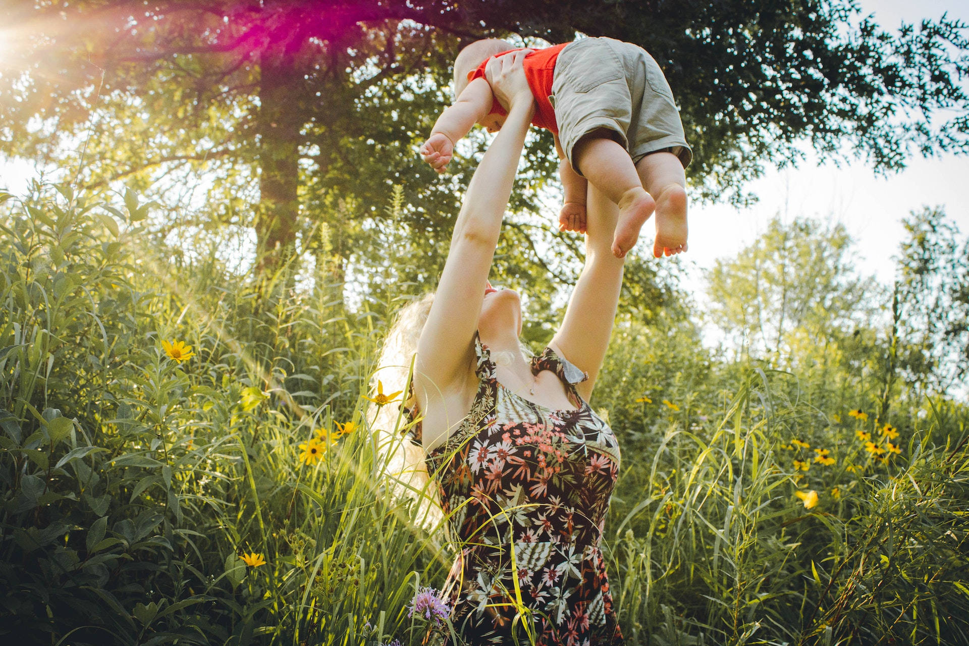 Mother Lifting Baby Love Background