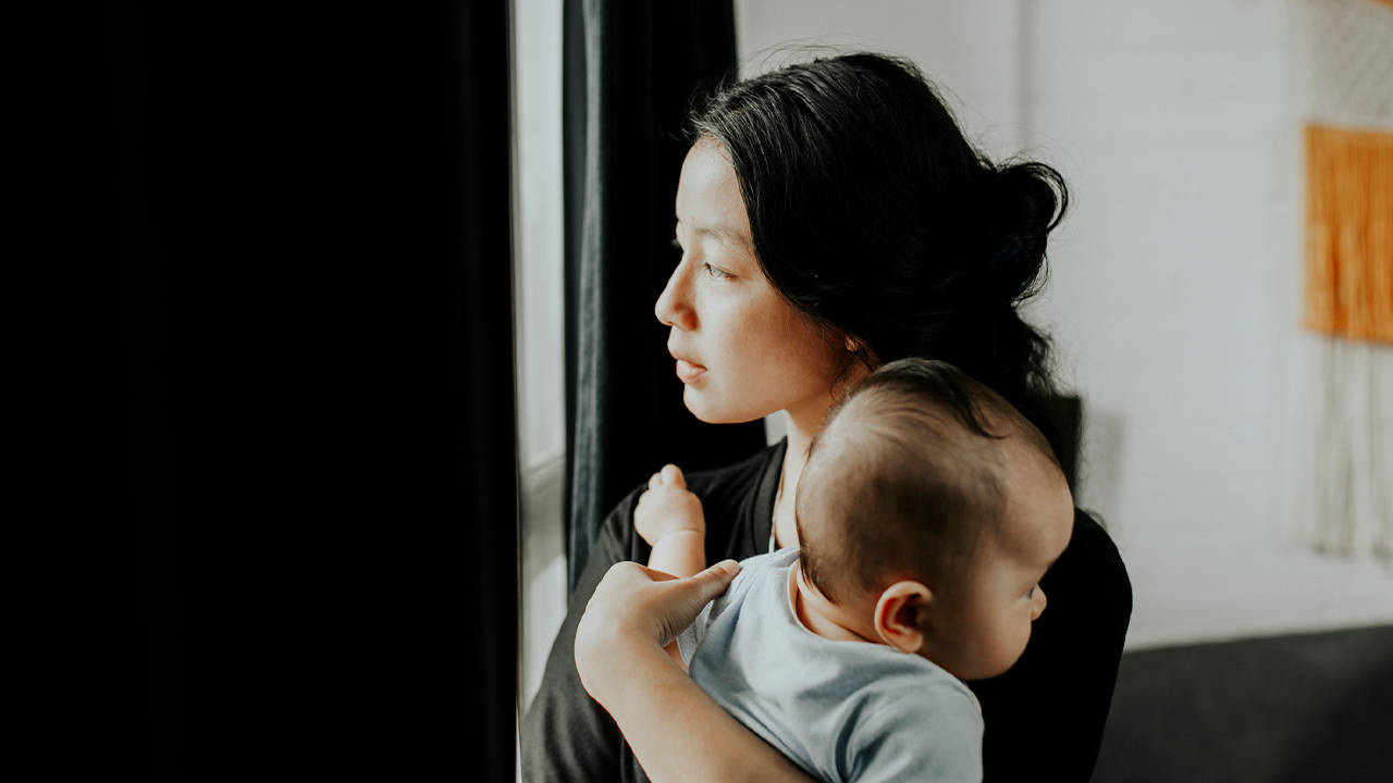 Mother Lovingly Gazing At Her Baby By The Window Background