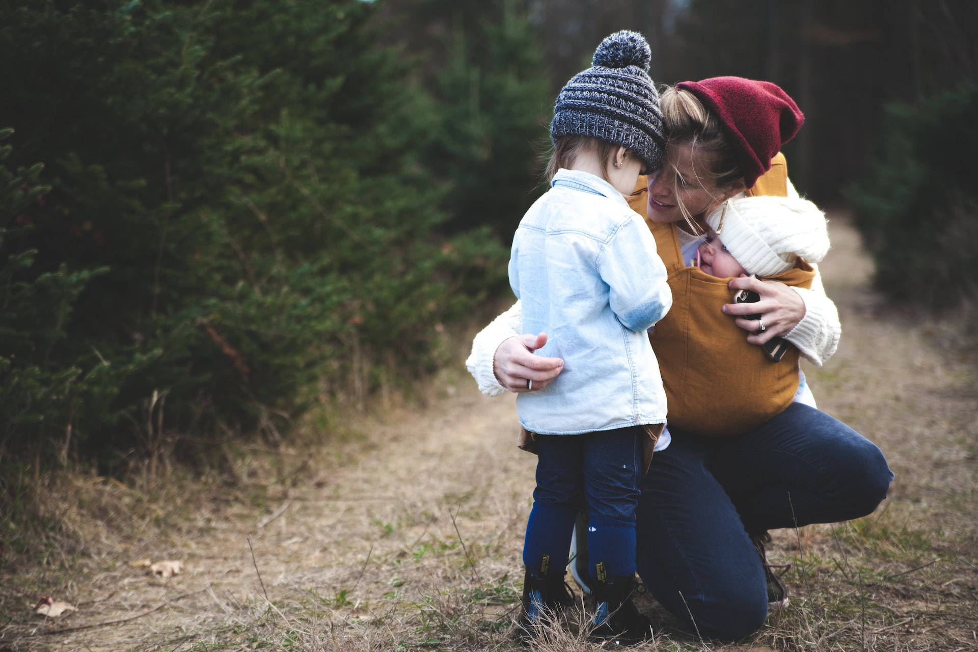 Mother, Toddler, And Baby Love Background