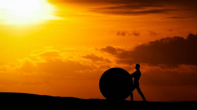 Motivation Man Pushing A Rock Sphere Background
