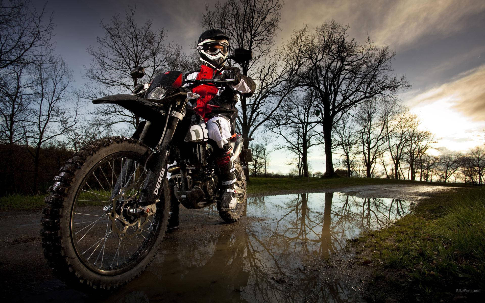 Motocross Black Helmet Wet Path Background