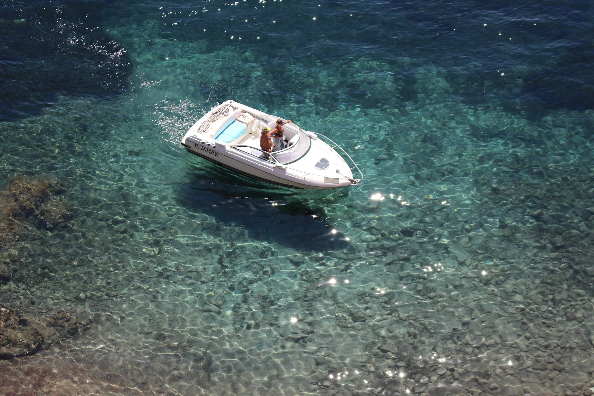 Motorboat In French Polynesia Sea Background