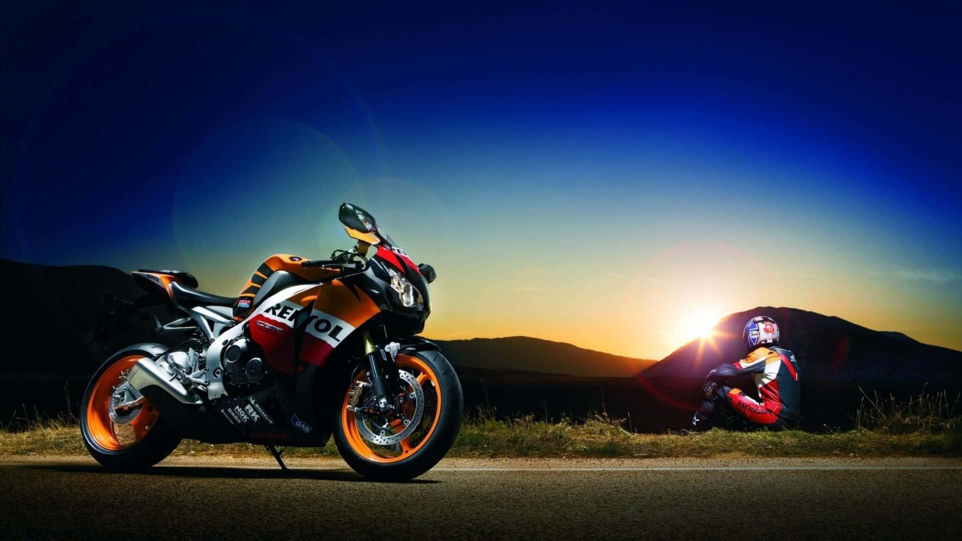 Motorcycleand Riderat Sunset Background