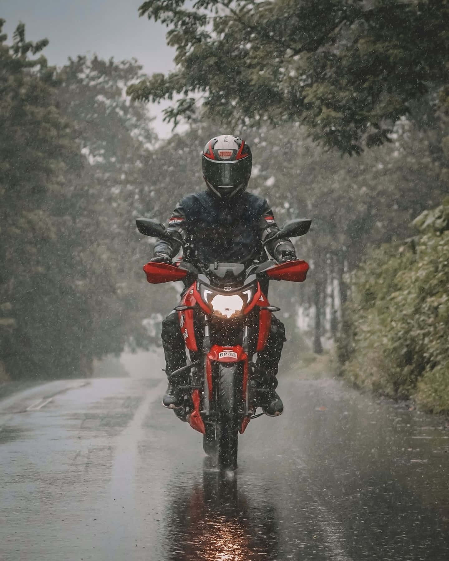 Motorcyclistin Rain Background