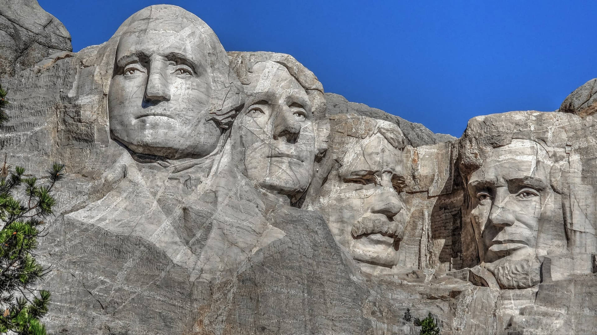 Mount Rushmore Sculpture On Clear Day Background