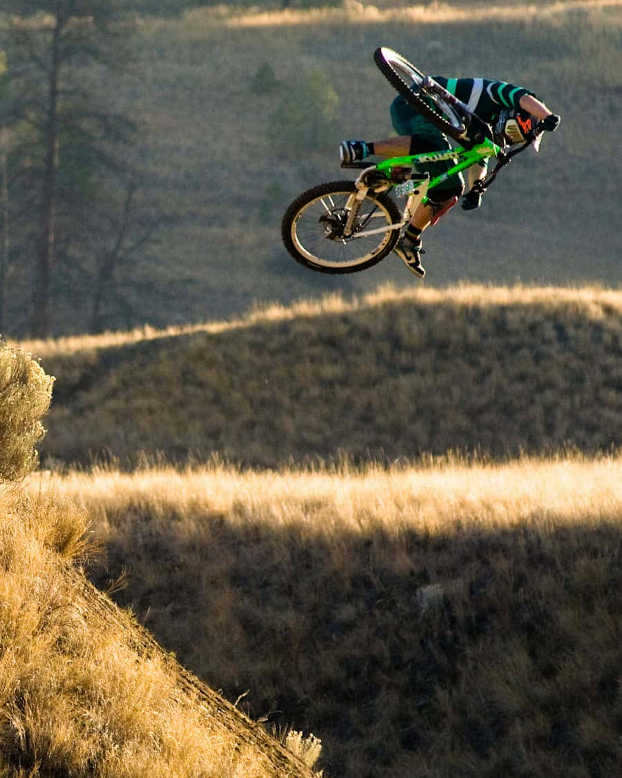 Mountain Biker Mid Air Stunt Background