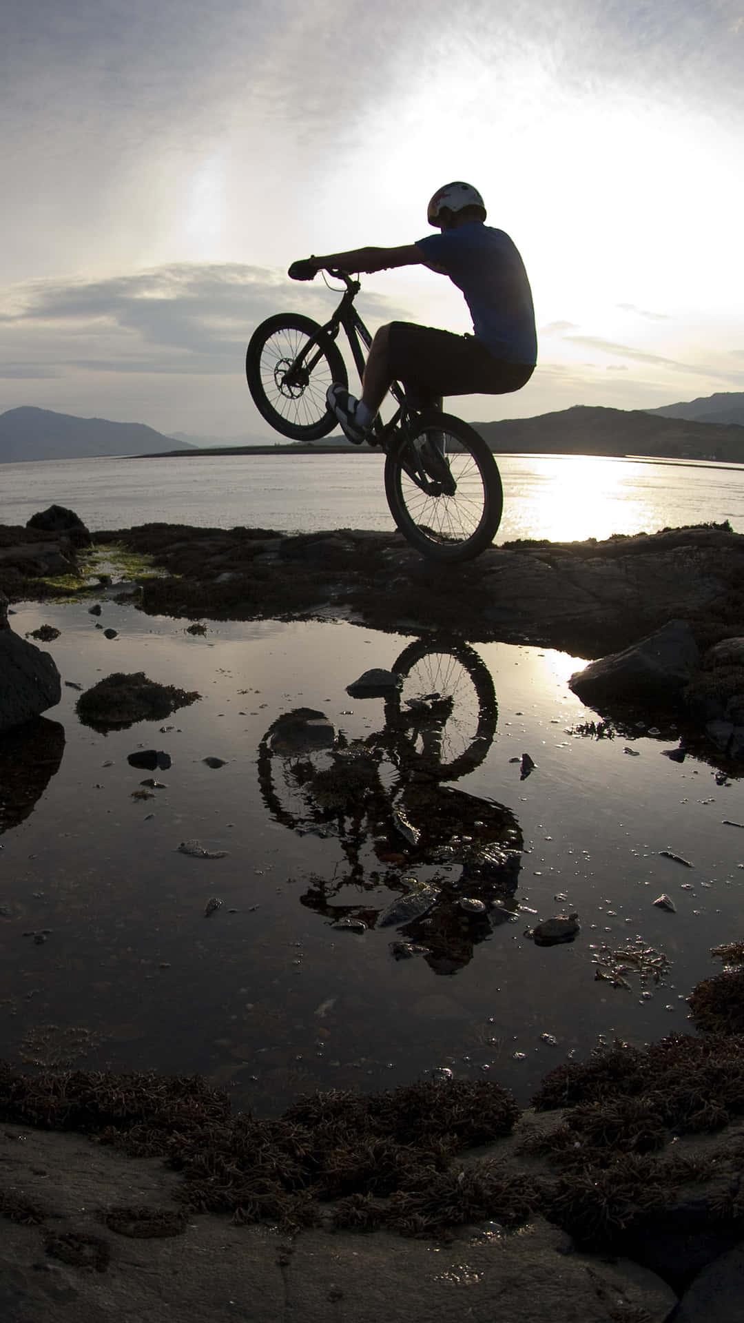 Mountain Biker Silhouetteat Sunset Background