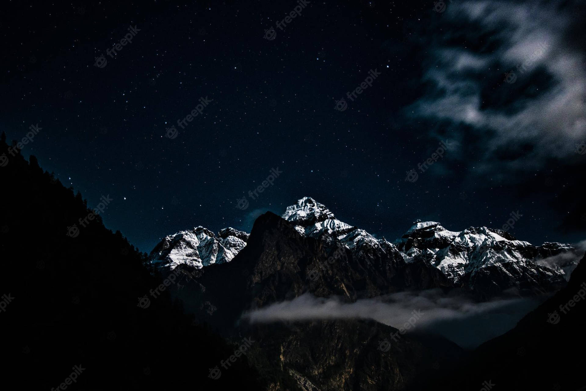 Mountain Range At Night With Clouds And Stars Background