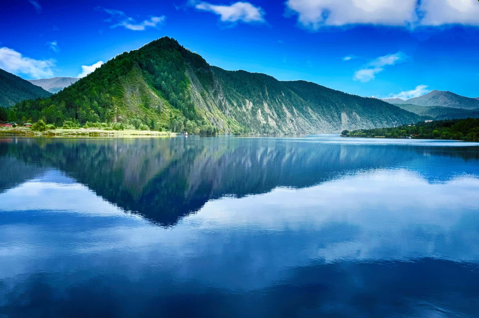 Mountain Reflection On A Majestic Lake Background