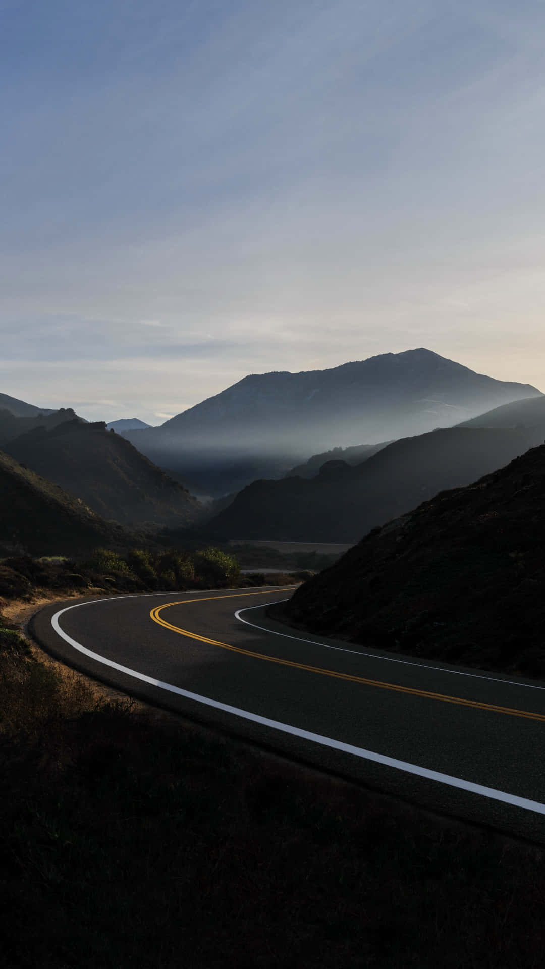 Mountain_ Road_at_ Dusk Background