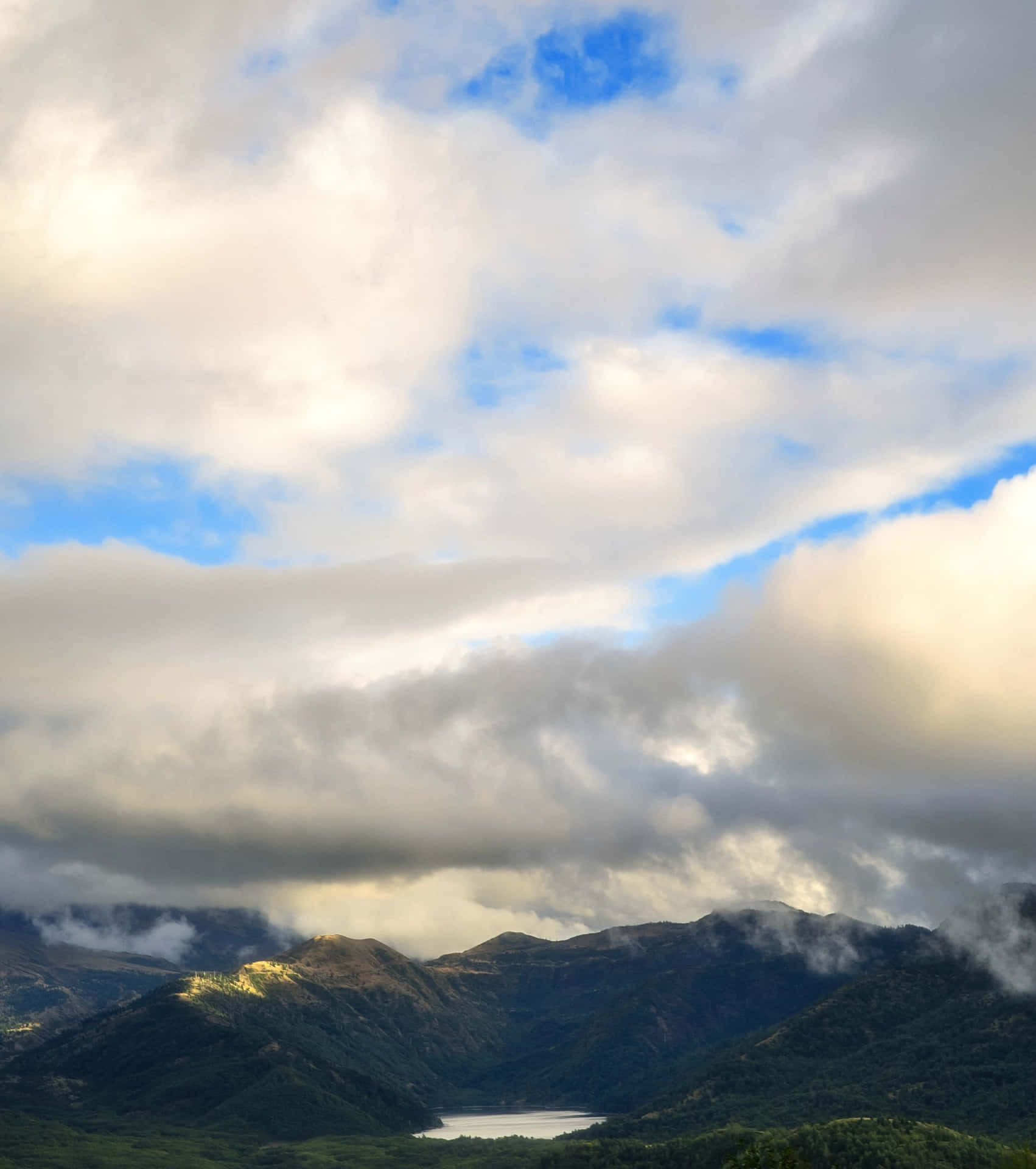 Mountainous_ Landscape_with_ Lake_and_ Clouds.jpg Background