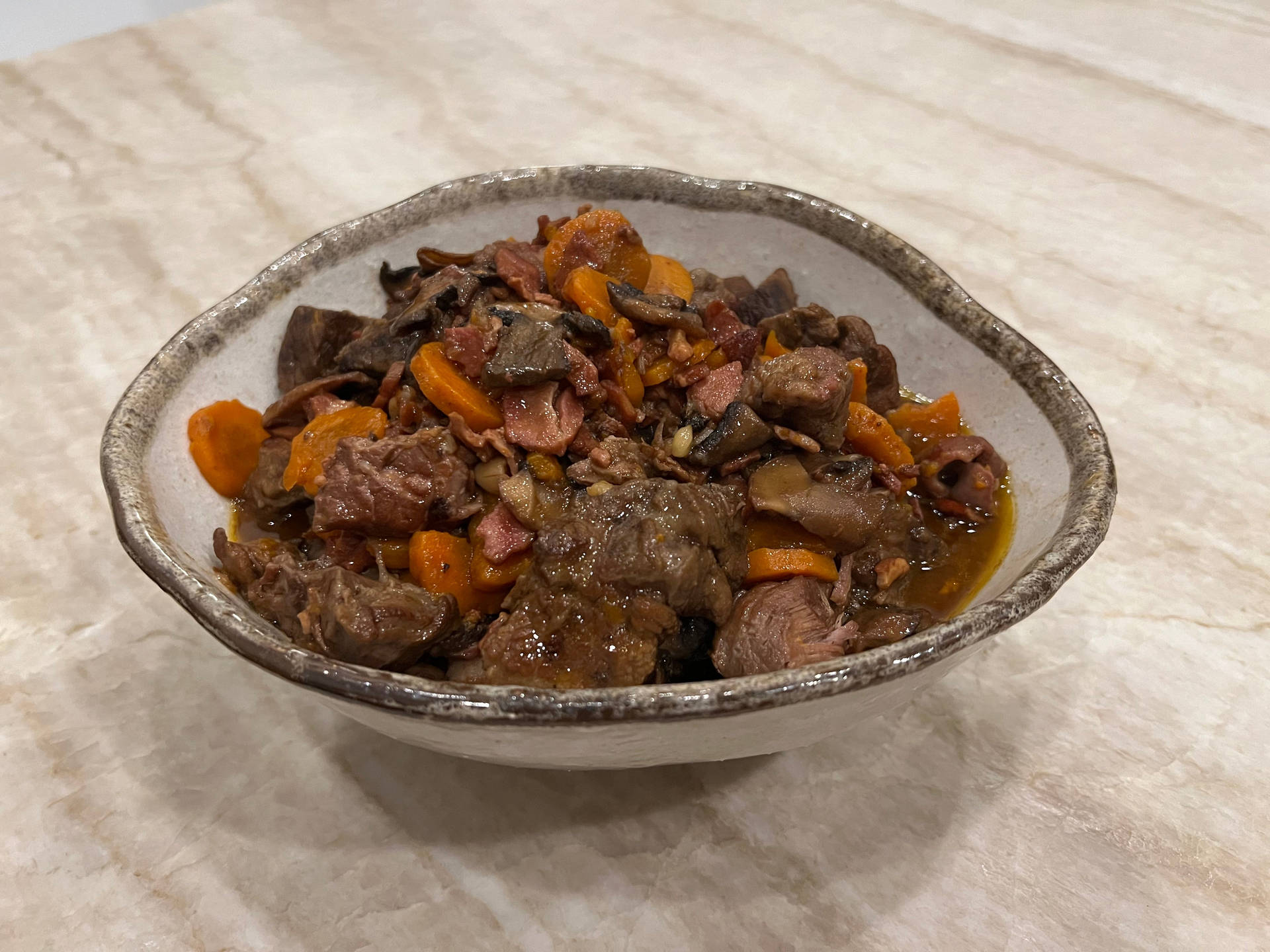 Mouthwatering Beef Bourguignon In Rustic Setting Background