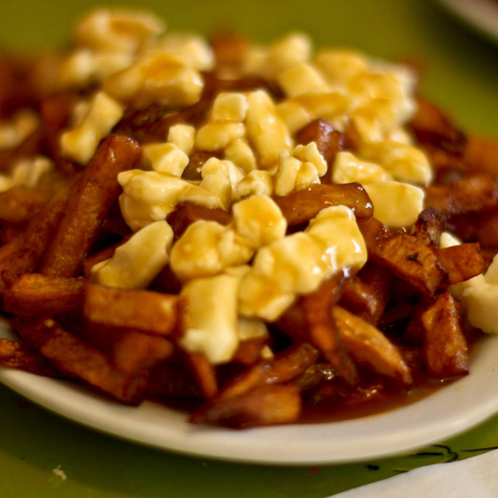 Mouthwatering Canadian Delicacy - Poutine Background