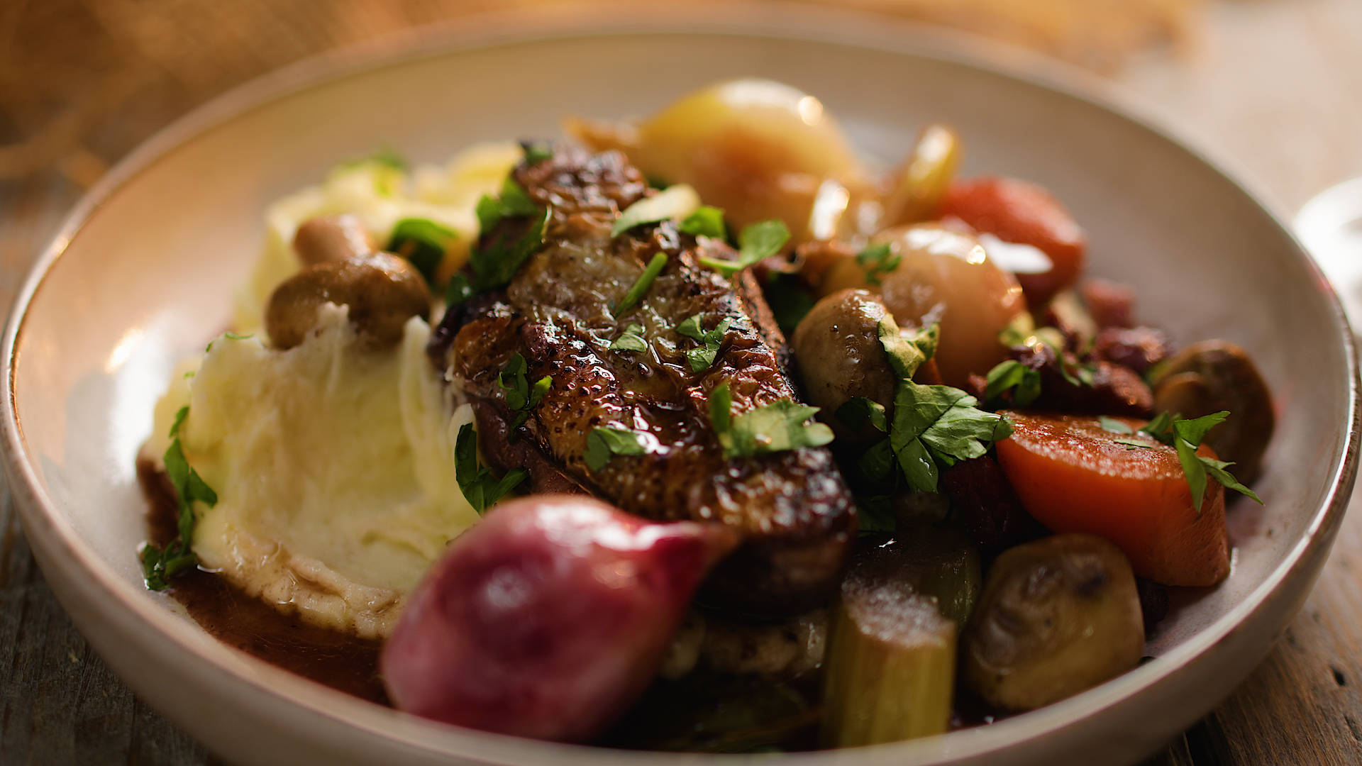 Mouthwatering Coq Au Vin Served On A Plate Background