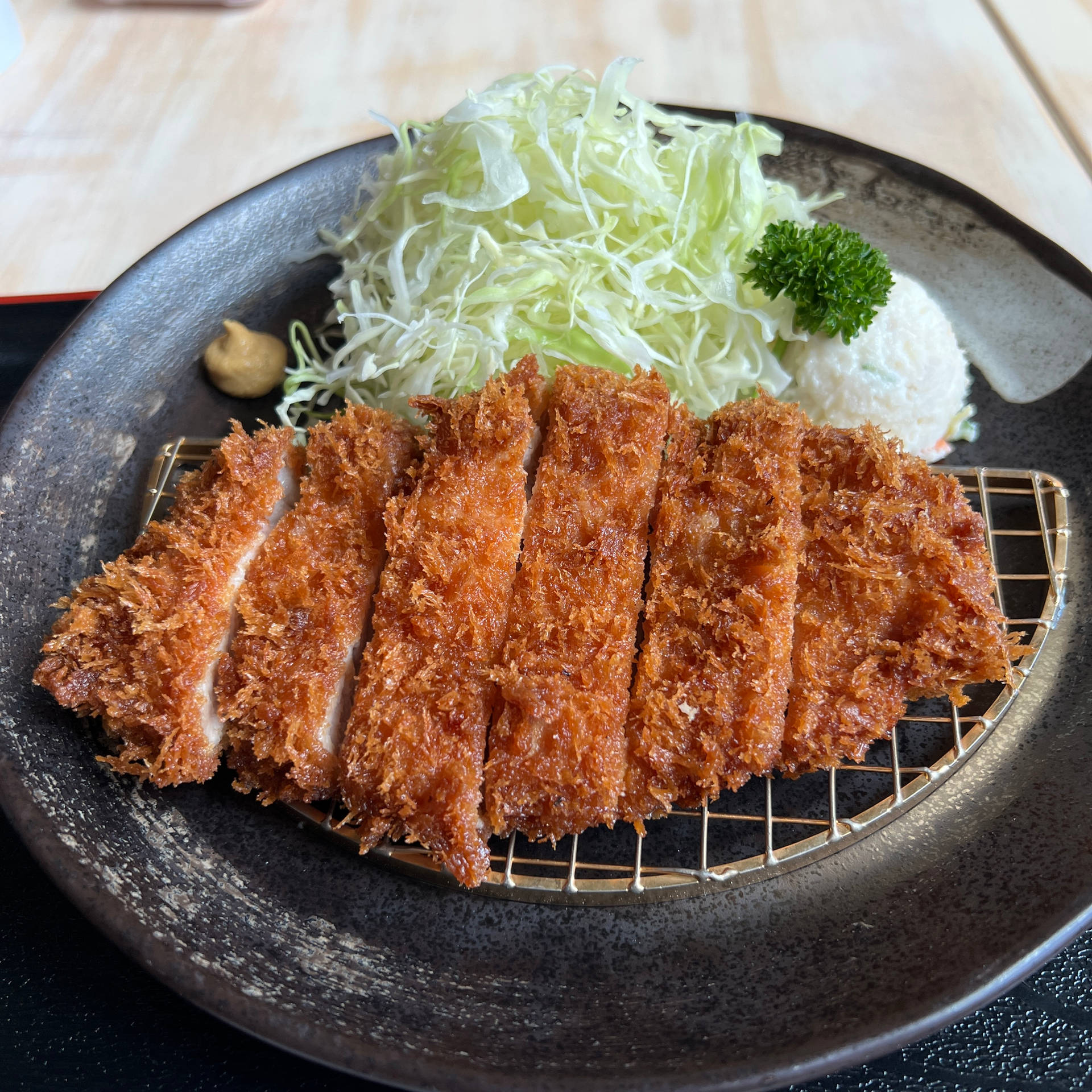 Mouthwatering Tonkatsu On A Grill Background