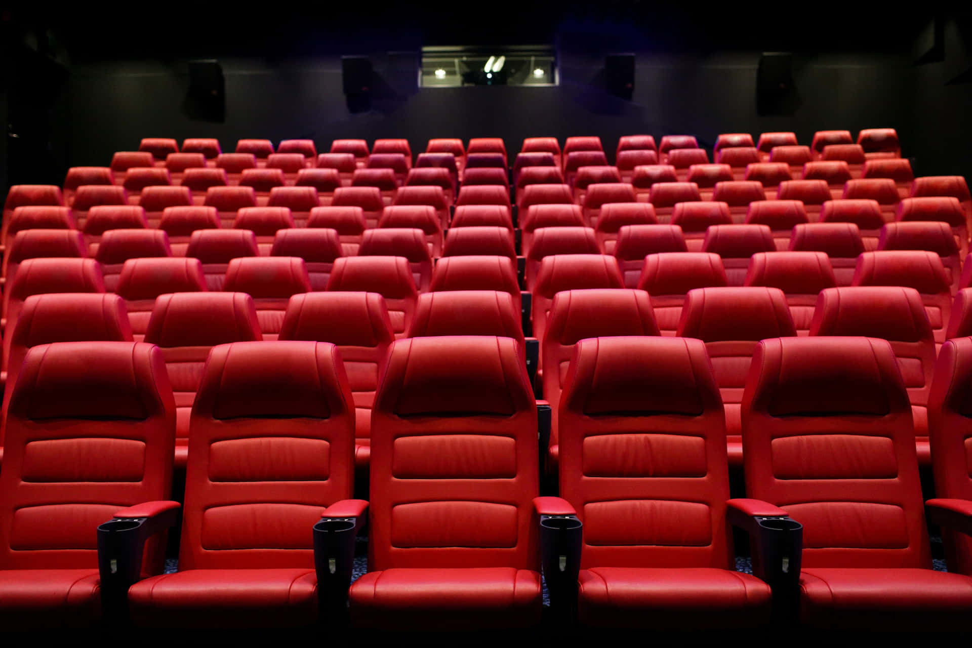 Movie Theater With Red Premium Leather Seats Background