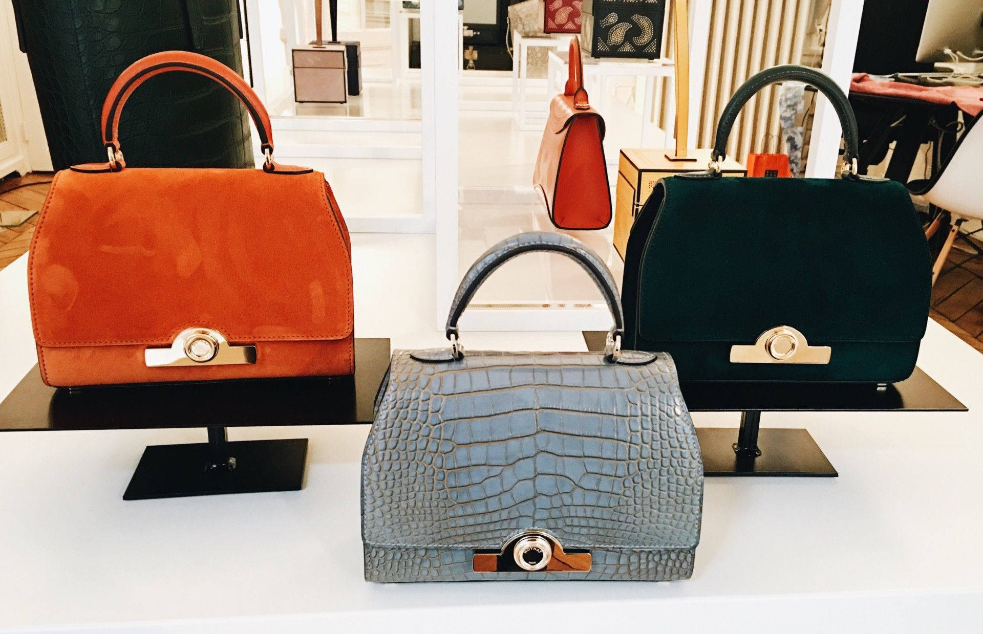 Moynat Bags On Display Background