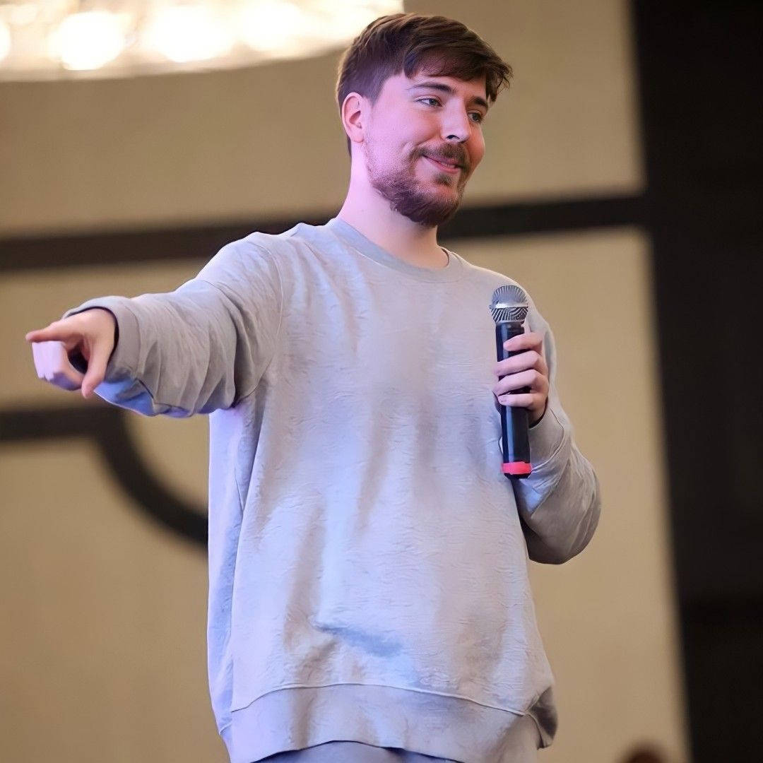 Mr Beast Pointing With Microphone Background