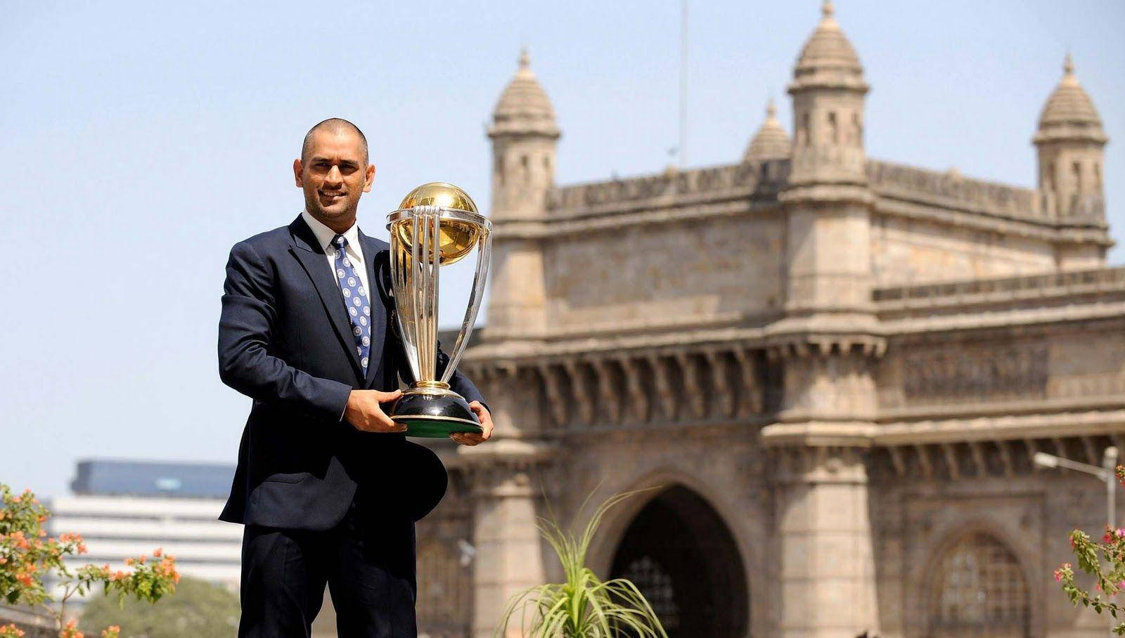 Ms Dhoni With Golden Championship Trophy Background