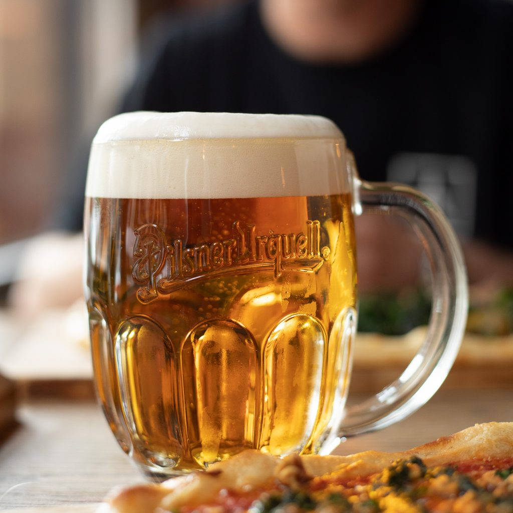 Mug Of Pilsner Urquell Background