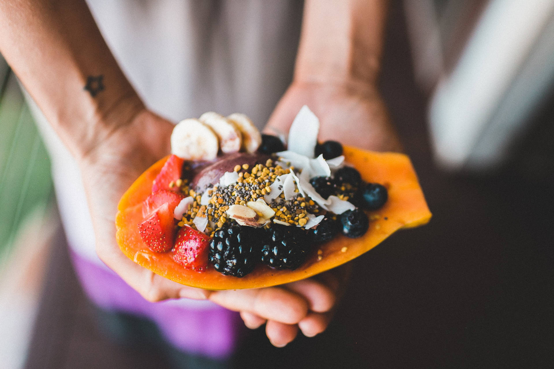 Mulberry And Other Fruits On Sliced Papaya Background