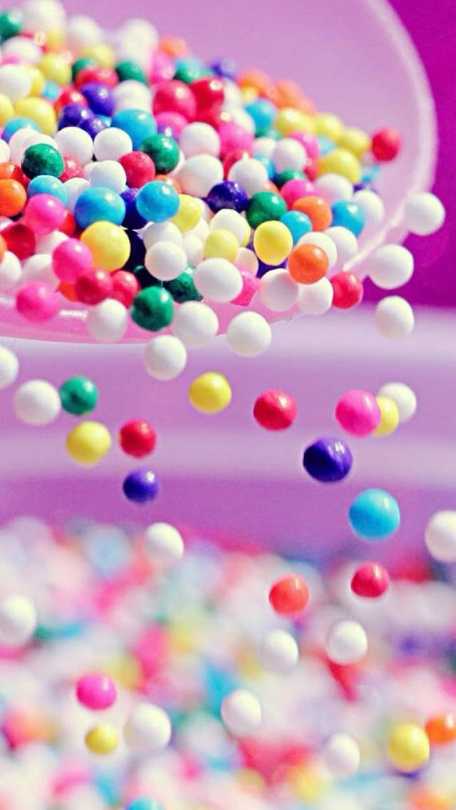 Multi-colored Beads In White Bowl Background