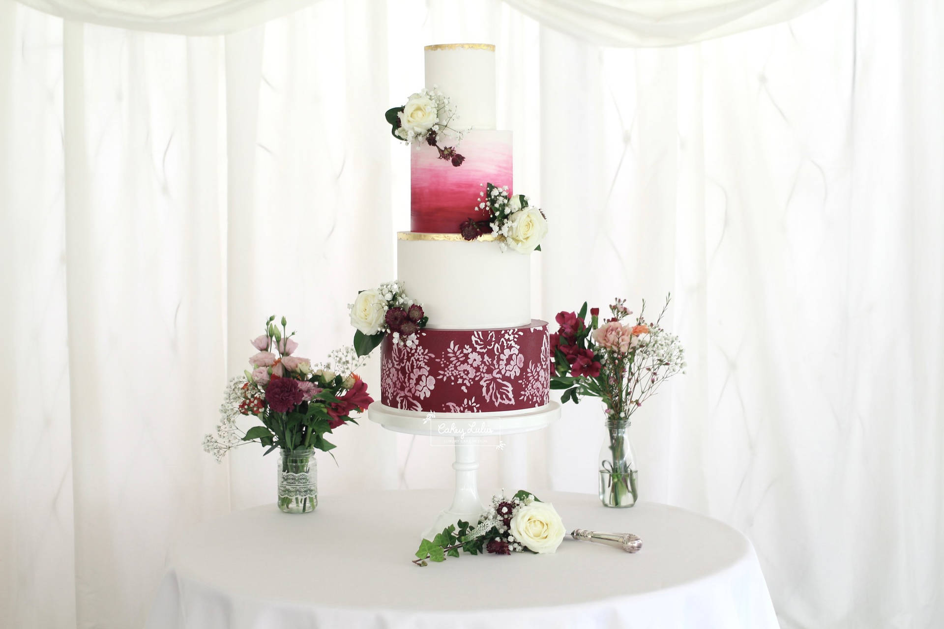 Multi Layered Wedding Cake With Scarlet Gradient Background