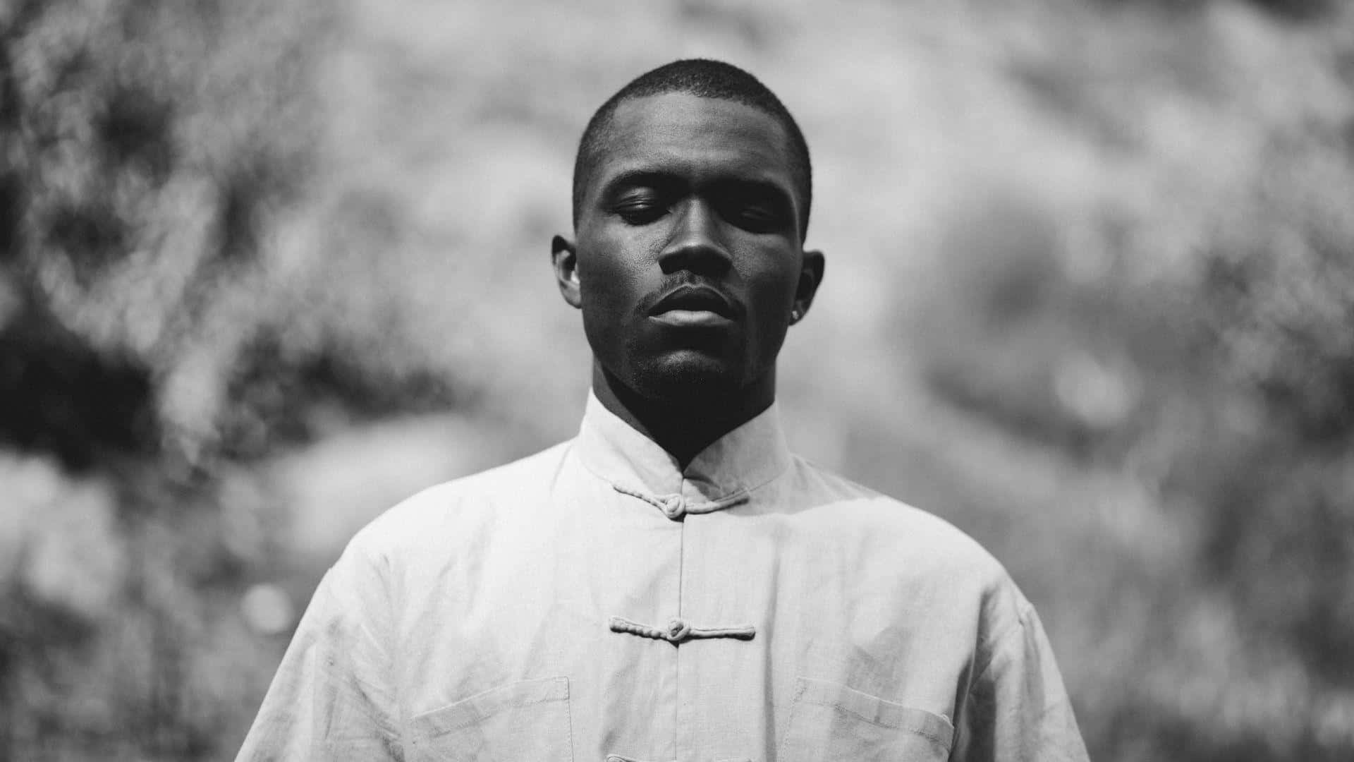 Multi-platinum Recording Artist Frank Ocean Relaxes With Laptop. Background