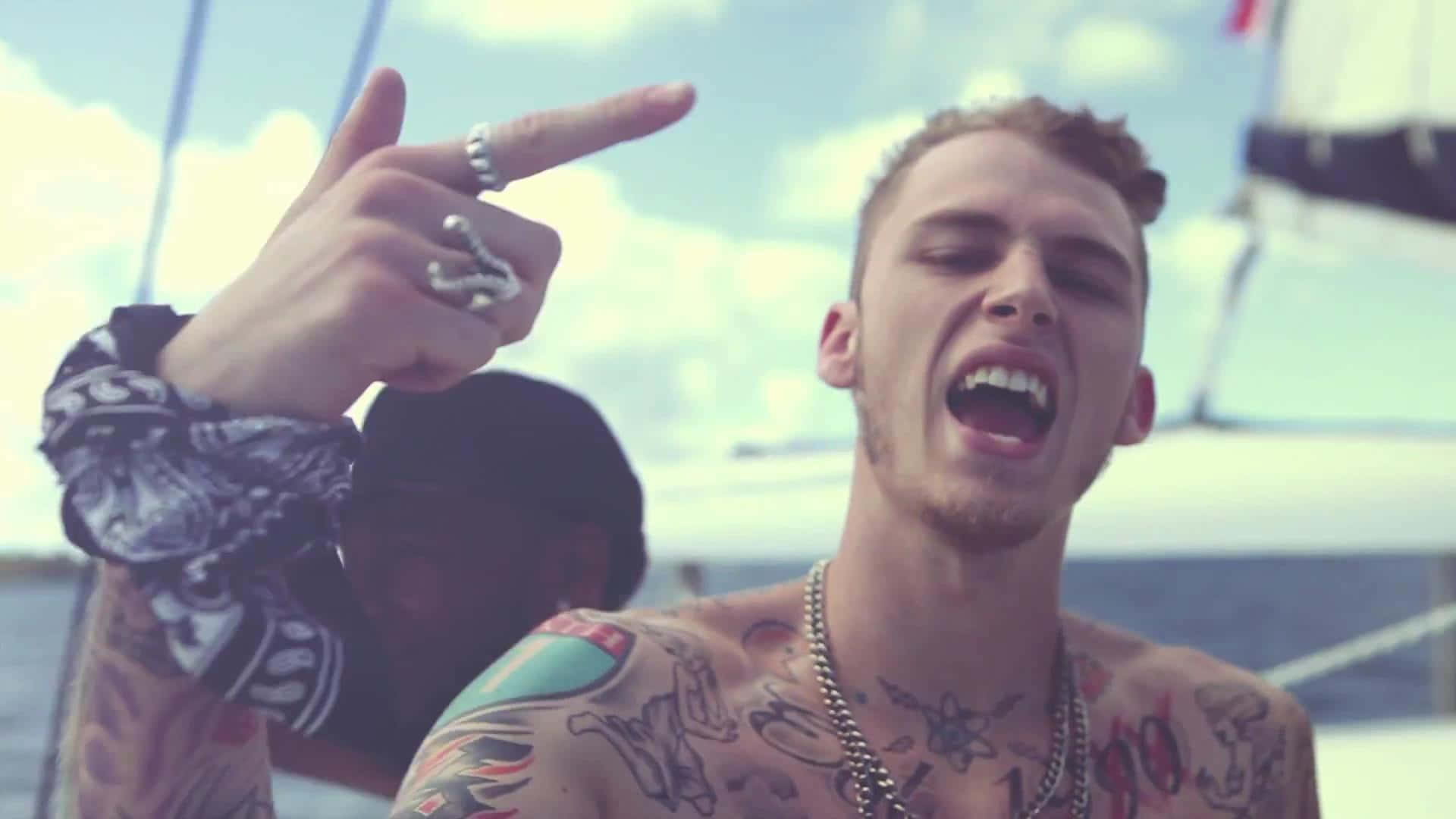 Multi Talented Artist Mgk Performing For An Adoring Crowd