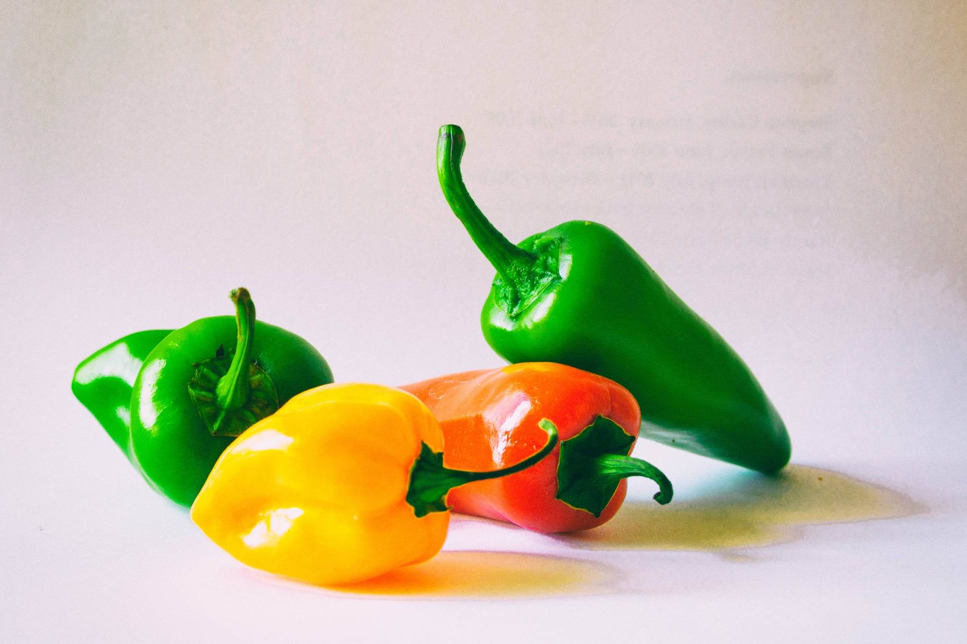 Multicolored Bell Pepper Fruits Textured Gray Backdrop